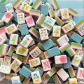 Sweet Pastel Bamboo Butterfly acrylic mahjong tile set piled in a blue gift box - colorful pastel American mahjong tiles with butterfly and bamboo designs - mahjong gift set for birthdays, holidays, and corporate gifts, NYC luxury gift shop, nationwide delivery