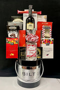 Customized corporate logo ice bucket gift with wine and assorted gourmet foods in red packaging, a branded client or holiday gift with NYC and nationwide delivery