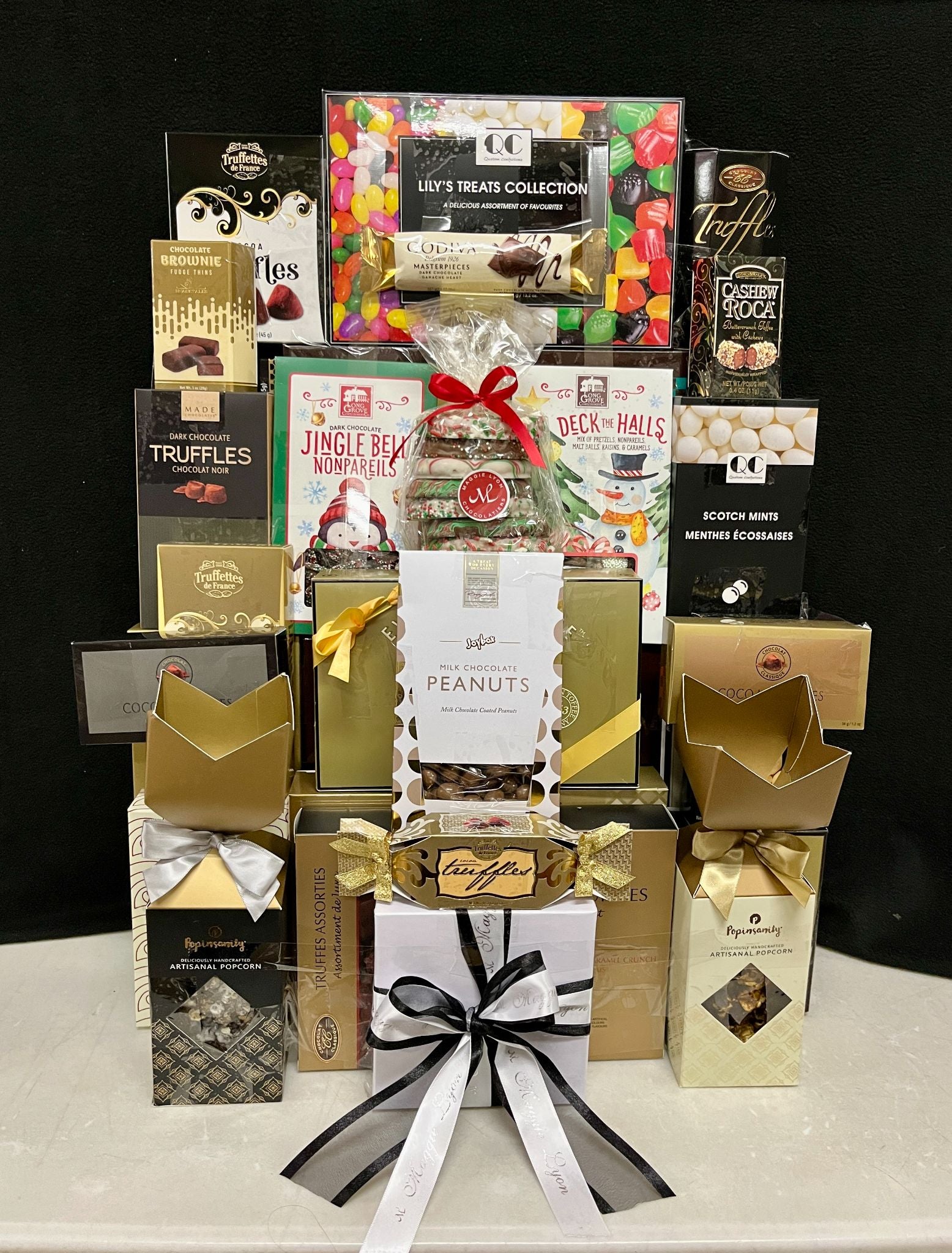 Deluxe Elegance Gourmet Gift Basket Luxury Gathering - abundant premium chocolates, cookies, nuts, and truffles in a classy gold, black, and red presentation - ideal for corporate gifting - NYC delivery and nationwide shipping
