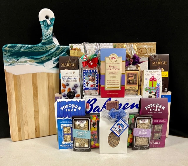Grand Collection luxury gourmet charcuterie board - show stopping handcrafted acacia wood and resin board overflowing with chocolates, nuts, biscotti, truffles, and savory treats, delivered nationwide and to New York City NYC - perfect for corporate holiday gifts, client appreciation, employee appreciation, and lease renewals