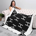 H monogram patterned reversible throw blanket, a cozy gift for the home, birthdays, get well, thank you, Mother’s Day, Father’s Day, staff appreciation day, Christmas and holidays. NYC / New York City corporate gifts and gifts for all occasions, with nationwide delivery from our Long Island gift store