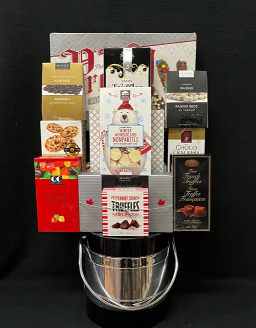 Black and silver holiday gourmet ice bucket filled with festive chocolates and treats, a corporate gift for NYC and Long Island with nationwide delivery