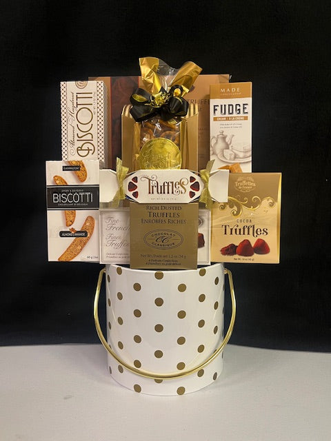 White-and-gold polka dot ice bucket gift basket filled with gourmet biscotti, truffles and fudge - an elegant corporate gift for New York clients, property managers and tenant renewals.