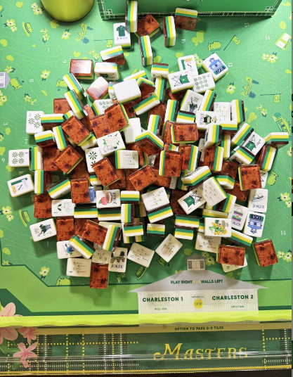 Luxury Golf Masters Themed Acrylic Mahjong Tile Set - green and gold Masters-branded tiles piled on official Masters game board with Charleston guide - unique golf gift - Corey Paige, Bespoke Mahjong, Oh My Mahjong alternative - NYC
