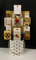 Luxury polka dot ice bucket gift basket filled with premium gourmet chocolates and treats - playful and chic corporate gift for NYC clients and tenant renewals