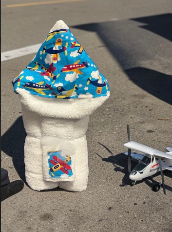 Airplane themed hooded baby towel - a high-flying bathtime gift for newborns and toddlers, delivered nationwide from New York