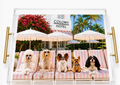 Palm Beach Colony Hotel dog art acrylic tray with gold-tone handles, five dogs on pink-striped loungers beneath white parasols, with palm trees and flowering greenery. A New York City and Long Island gift for birthdays, home decor, corporate gifts, staff appreciation day, Christmas, holidays, thank you, get well, Mother’s Day and Father’s Day, with nationwide delivery from our Long Island gift store for gifts for all occasions.