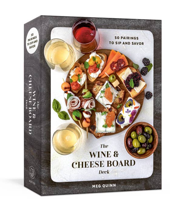 The Wine & Cheese Board Deck by Meg Quinn, boxed pairing cards with packaging featuring wine glasses, cheeses, appetizers, and olives