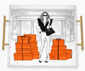 Fashion illustration acrylic tray with gold-tone handles, showing a woman in sunglasses with a black handbag beside orange gift boxes tied with black ribbons. A New York City gift for birthdays, home decor, corporate gifts, staff appreciation day, Christmas, holidays, thank-you gifts, get well, Mother’s Day, and Father’s Day, with nationwide delivery from our Long Island gift store for gifts for all occasions