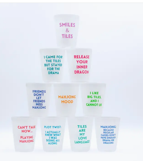 Set of 10 frosted reusable mahjong cups in assorted colors, each printed with a different mahjong phrase - perfect for beach and backyard entertaining