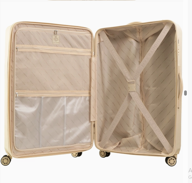Max Studio hard sided luggage open interior showing mesh compartments and fastening straps - expandable TSA-approved spinner suitcase - travel gifts for all occasions - The Pampered Professional