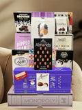 Monopoly bookshelf game styled in a home setting - luxury corporate gift basket for New York property managers and real estate professionals