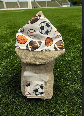 Beige multi-sport hooded baby towel - a fun bathtime or poolside gift for newborns and toddlers, shipped nationwide from New York