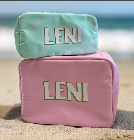 Set of 2 personalized pastel baby pouches monogrammed with name - mint and pink zip-top organizers on beach sand for diaper bag and beach bag - new baby gift, New York City and Long Island gift store, nationwide delivery