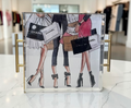 Acrylic tray with gold handles featuring a fashion illustration of women carrying Chanel, Prada, and Gucci shopping bags - designer gift tray from The Pampered Professional, Long Island NYC